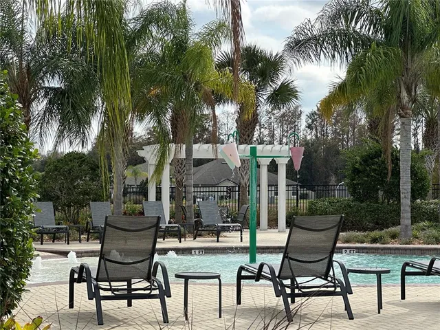 a view of a chairs and table in patio