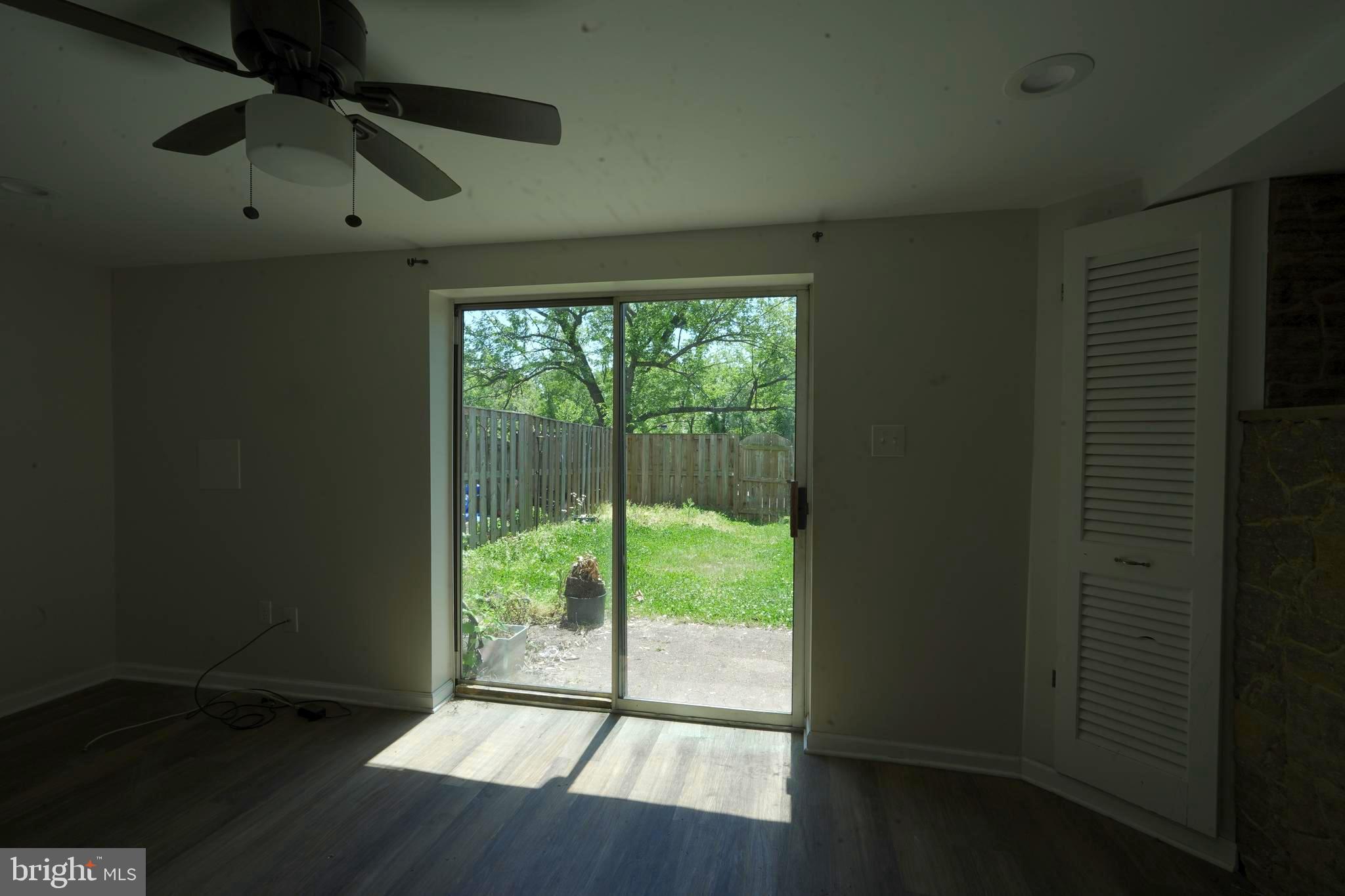 12836 Claxton Drive, Unit 4E Laurel, MD 20708 - Photo 11 of 13 a view of empty room with wooden floor and fan