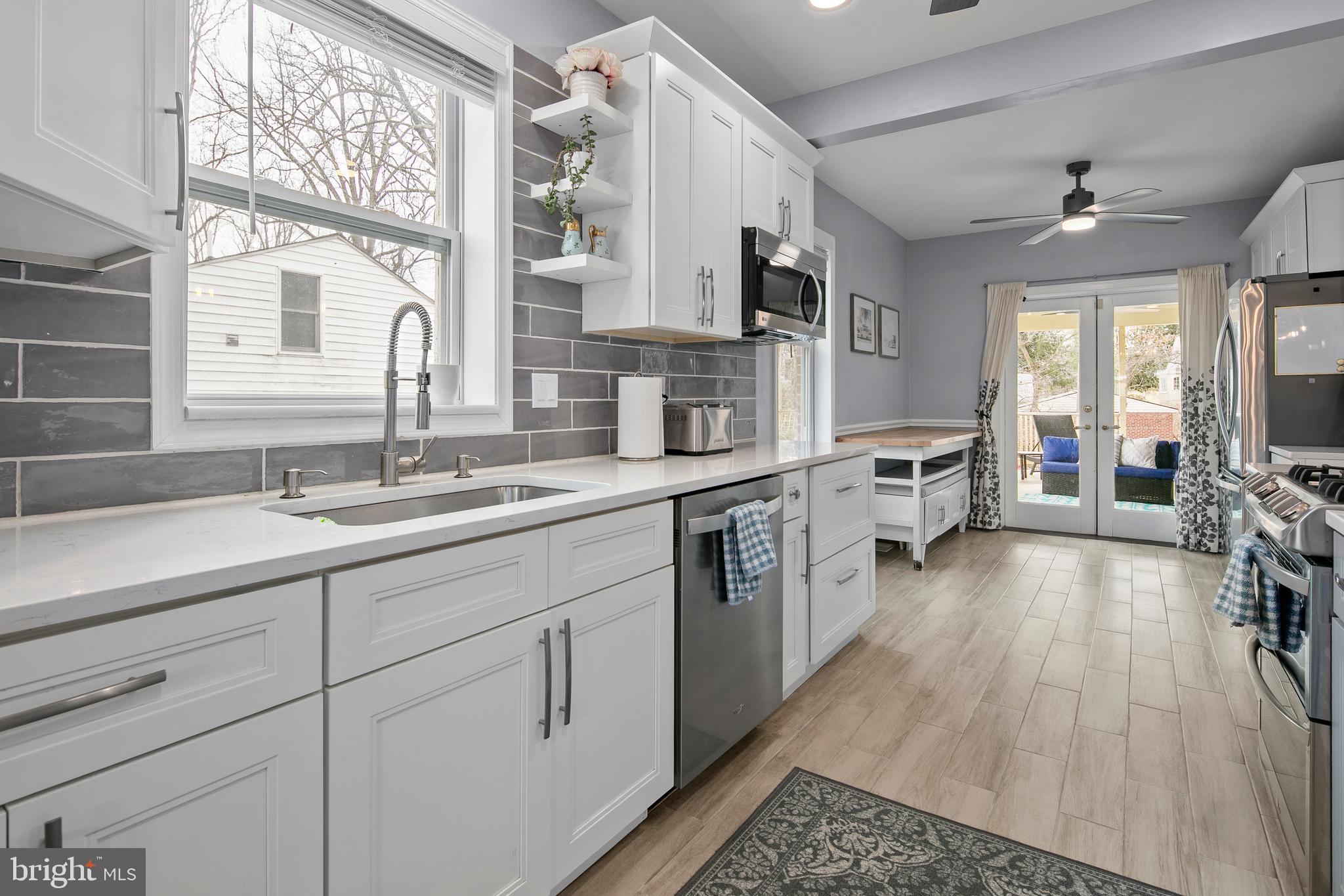 1212 Dale Drive Silver Spring, MD 20910 - Photo 11 of 59 a open kitchen with stainless steel appliances granite countertop a lot of counter space and windows