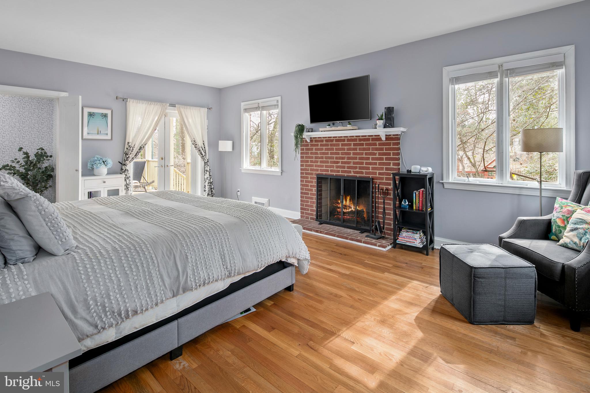 1212 Dale Drive Silver Spring, MD 20910 - Photo 17 of 59 a spacious bedroom with a balcony furniture and a fireplace