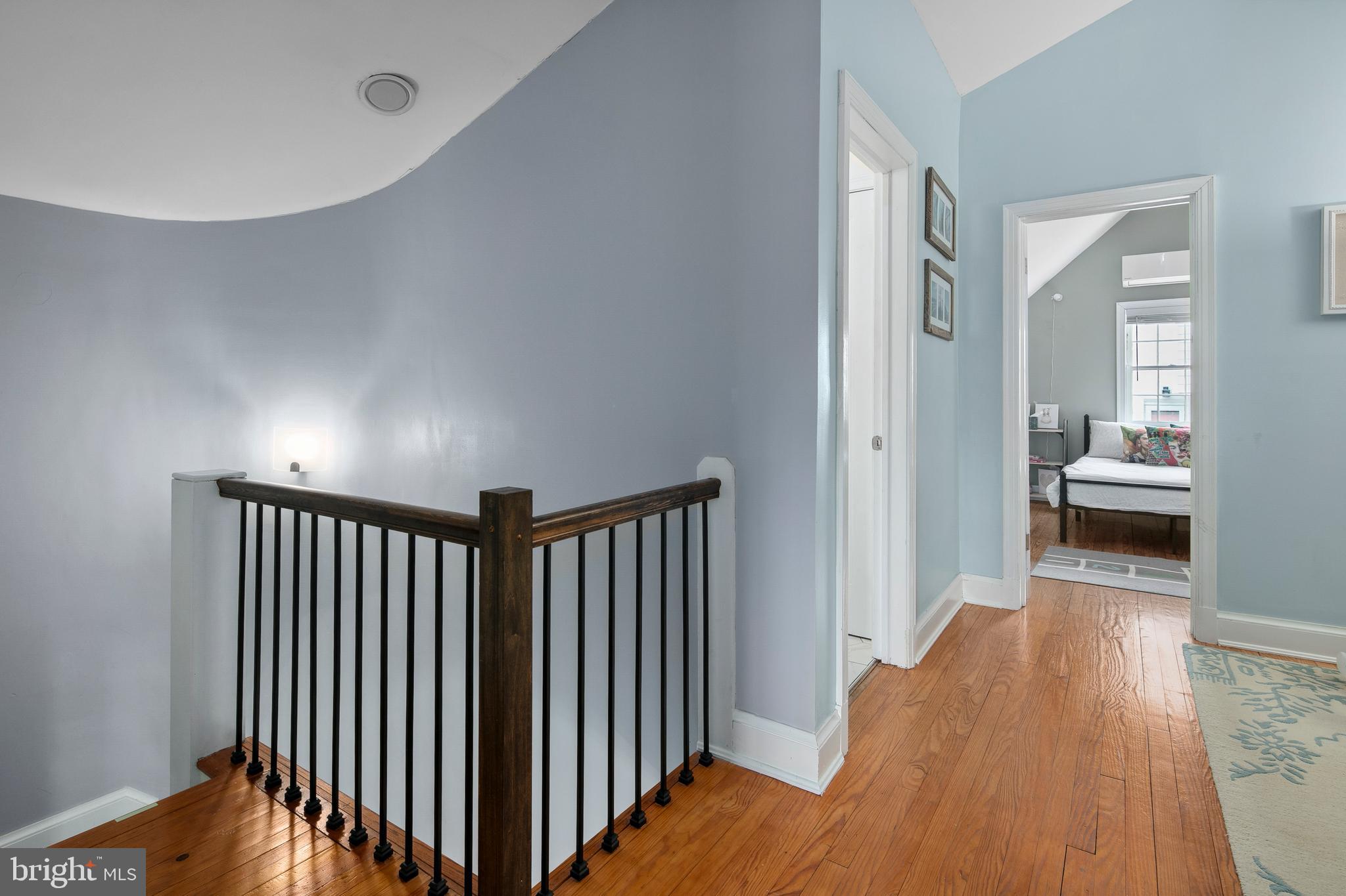 1212 Dale Drive Silver Spring, MD 20910 - Photo 26 of 59 a view of a hallway with wooden floor and a bedroom