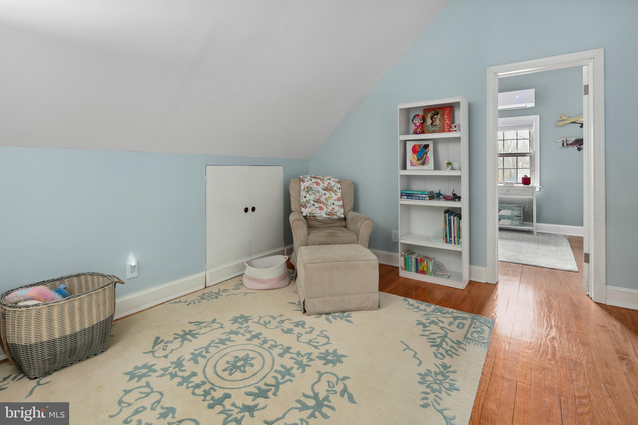 1212 Dale Drive Silver Spring, MD 20910 - Photo 28 of 59 a bedroom with a bed and wooden floor
