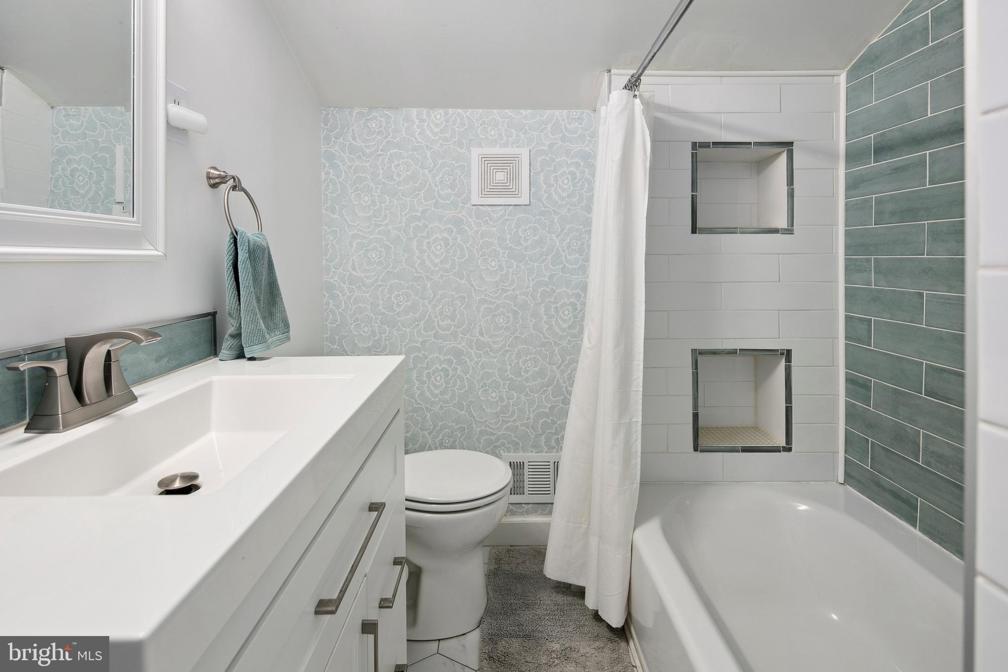 1212 Dale Drive Silver Spring, MD 20910 - Photo 31 of 59 a bathroom with a sink a toilet and shower