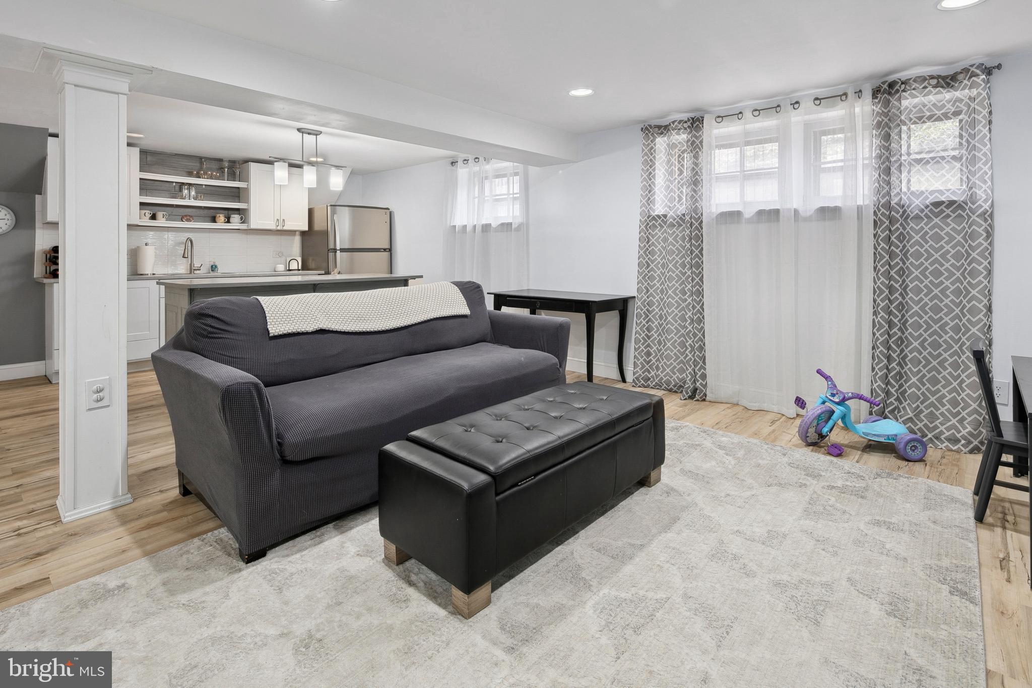 1212 Dale Drive Silver Spring, MD 20910 - Photo 37 of 59 a living room with furniture and a flat screen tv
