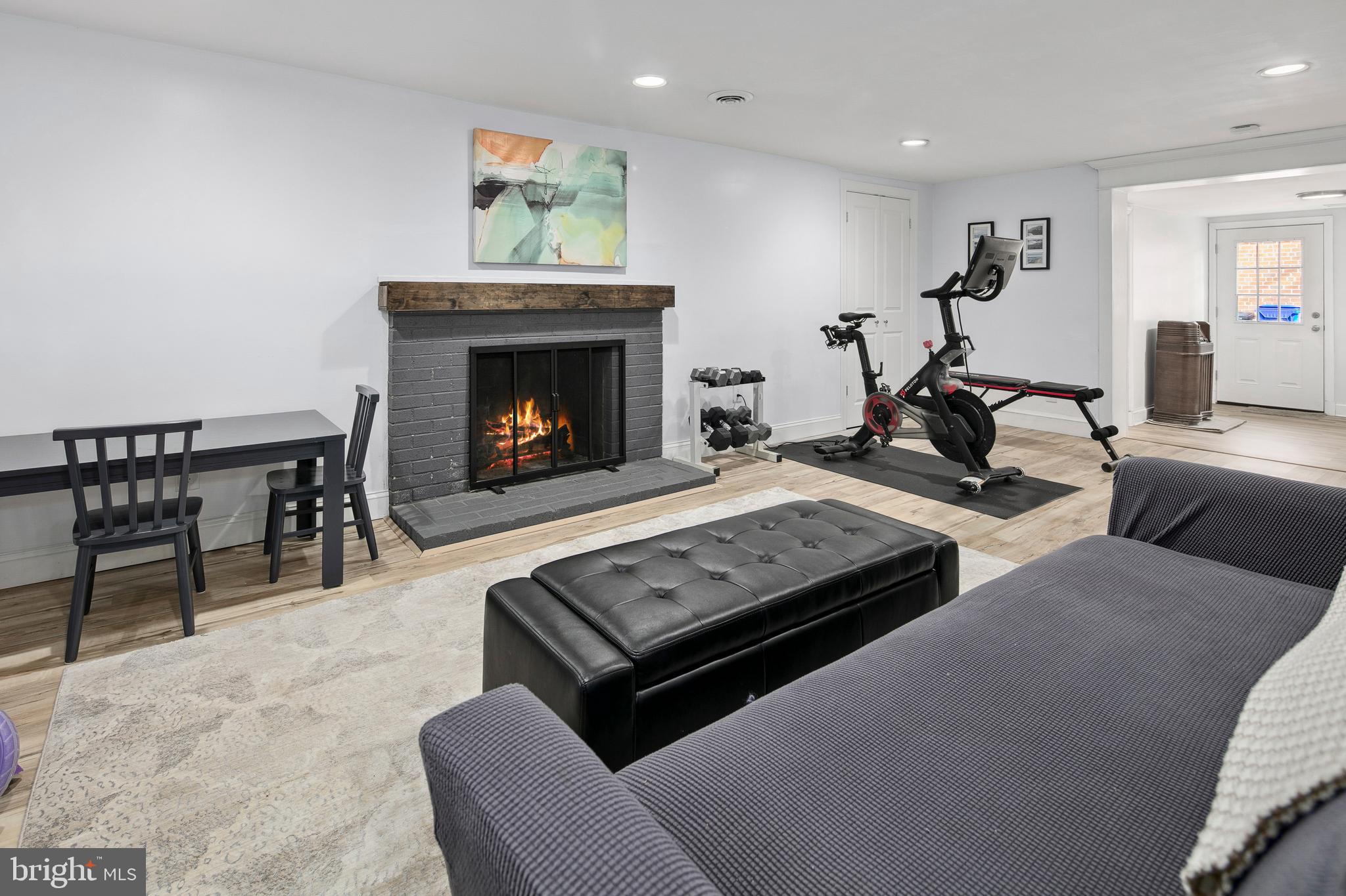 1212 Dale Drive Silver Spring, MD 20910 - Photo 38 of 59 a living room with furniture a fireplace and a table