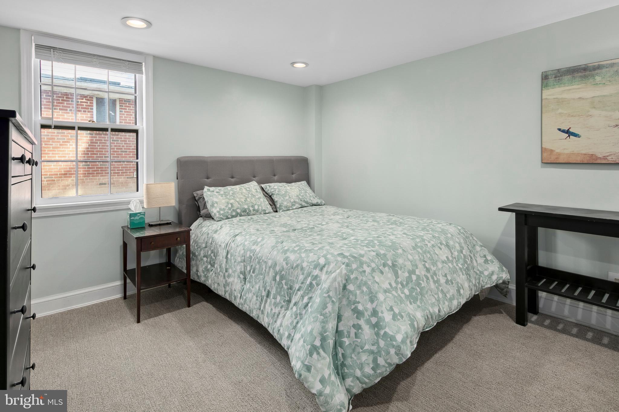 1212 Dale Drive Silver Spring, MD 20910 - Photo 44 of 59 a bedroom with a bed and a window