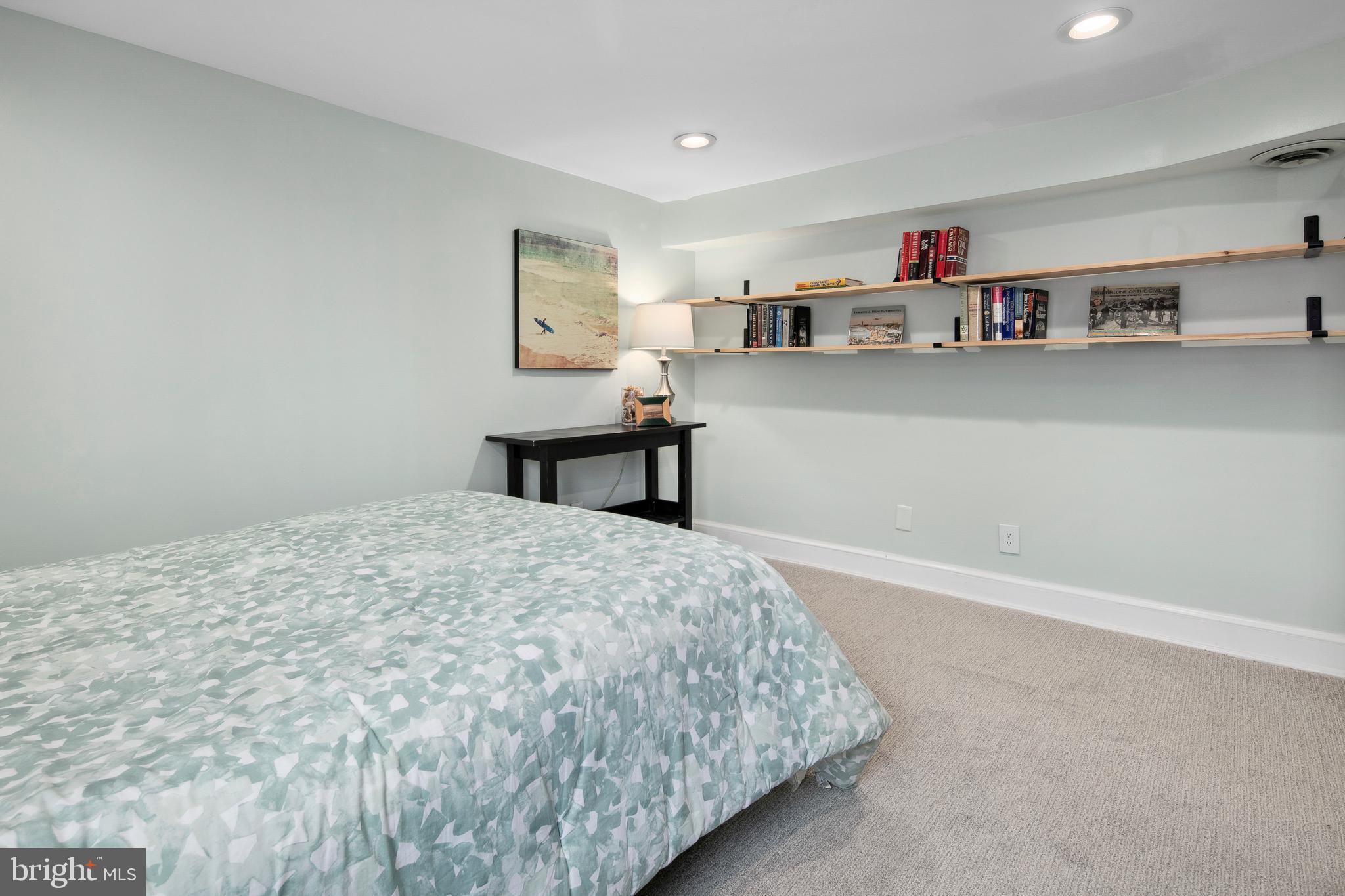 1212 Dale Drive Silver Spring, MD 20910 - Photo 45 of 59 a bedroom with a bed and cabinets