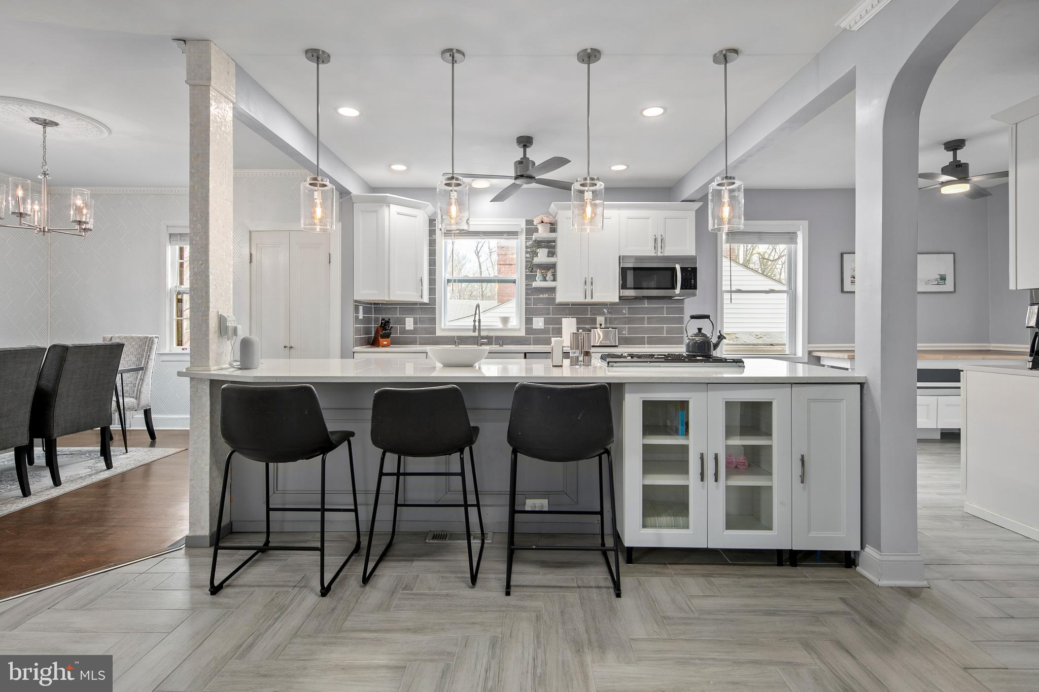 1212 Dale Drive Silver Spring, MD 20910 - Photo 7 of 59 a large kitchen with a table and chairs