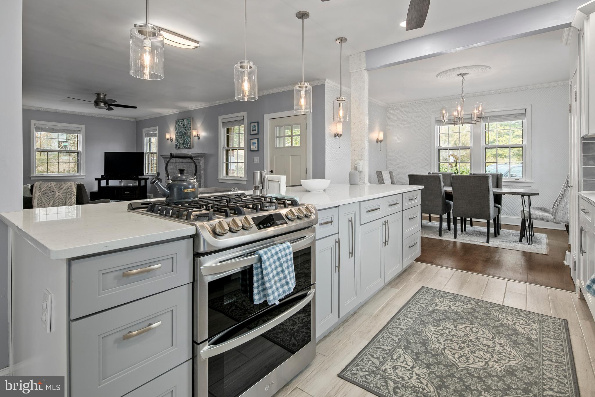 1212 Dale Drive Silver Spring, MD 20910 - Photo 9 of 59 a kitchen with a stove cabinets and wooden floor