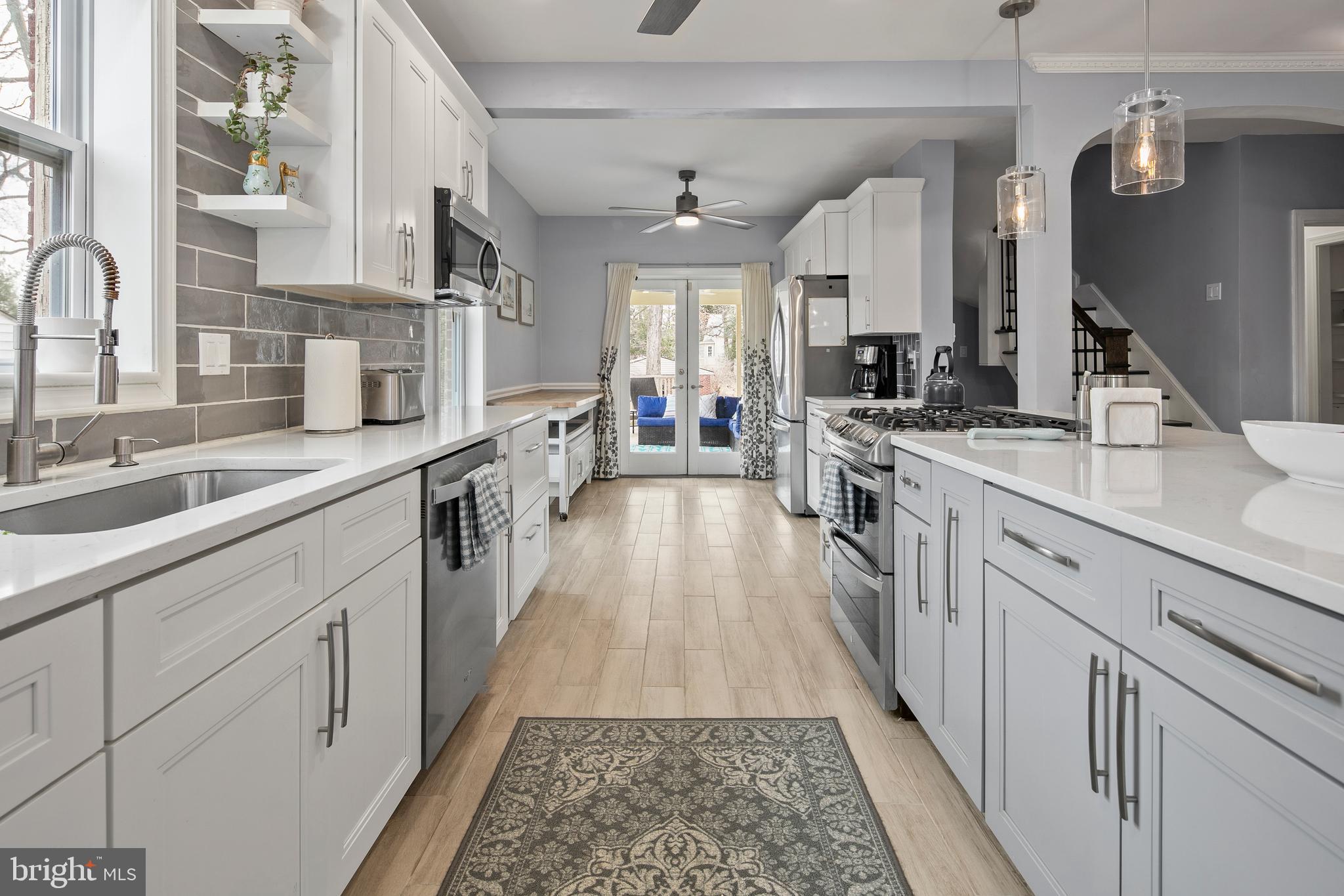 1212 Dale Drive Silver Spring, MD 20910 - Photo 10 of 59 a large kitchen with stainless steel appliances lots of counter space and a sink