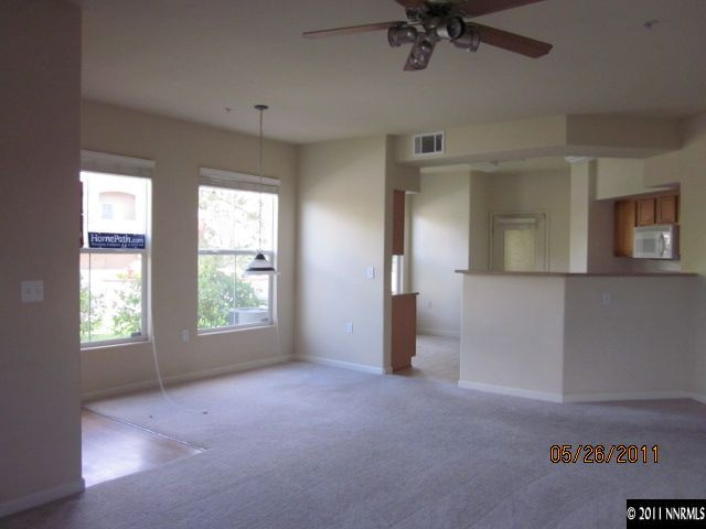 9050 Double R Boulevard, Unit 111 Reno, NV 89511 - Photo 3 of 8 an empty room with a window