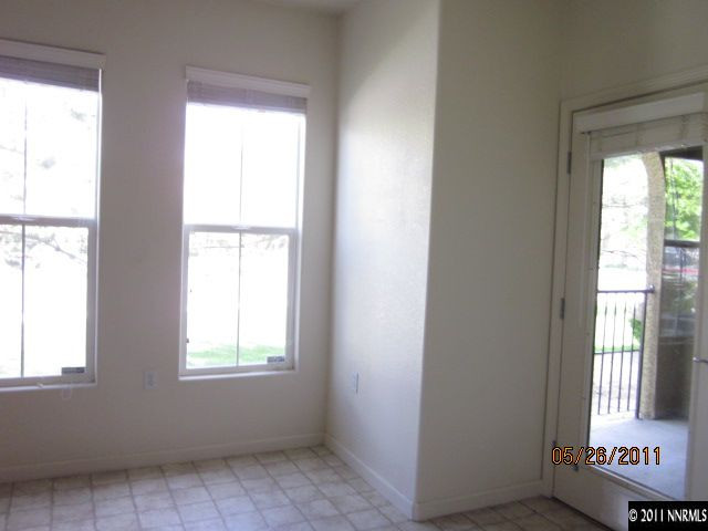 9050 Double R Boulevard, Unit 111 Reno, NV 89511 - Photo 5 of 8 a view of an empty room with a window