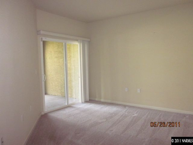 9050 Double R Boulevard, Unit 111 Reno, NV 89511 - Photo 6 of 8 a view of an empty room and a window