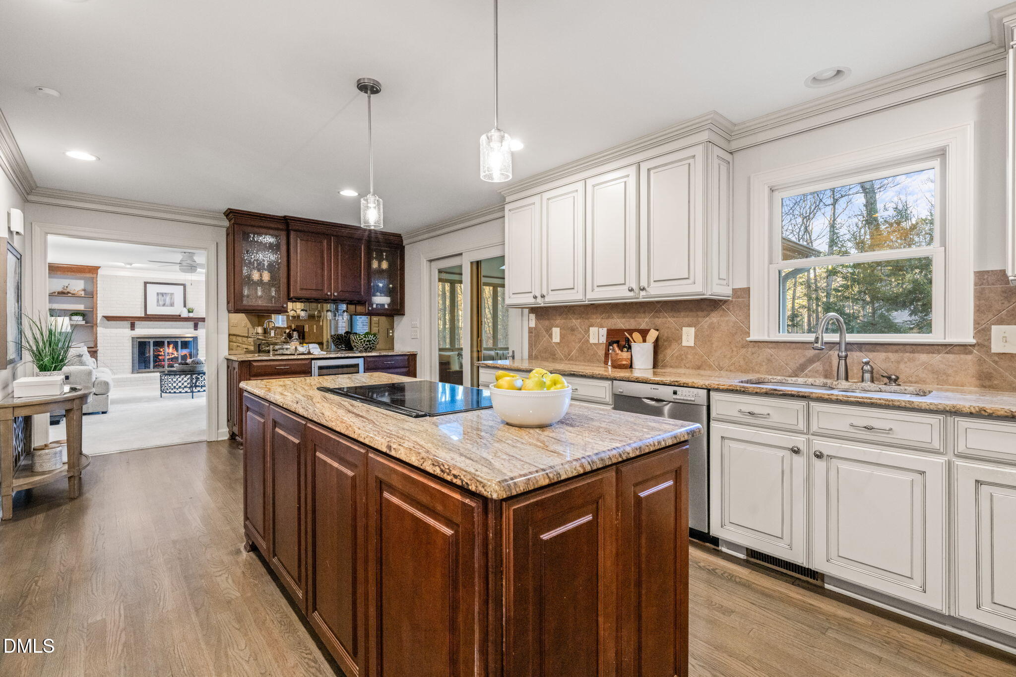 2300 Vly Frg Road Raleigh, NC 27615 - Photo 11 of 62 a kitchen with stainless steel appliances granite countertop a stove a sink dishwasher a microwave oven and a dining table with wooden floor
