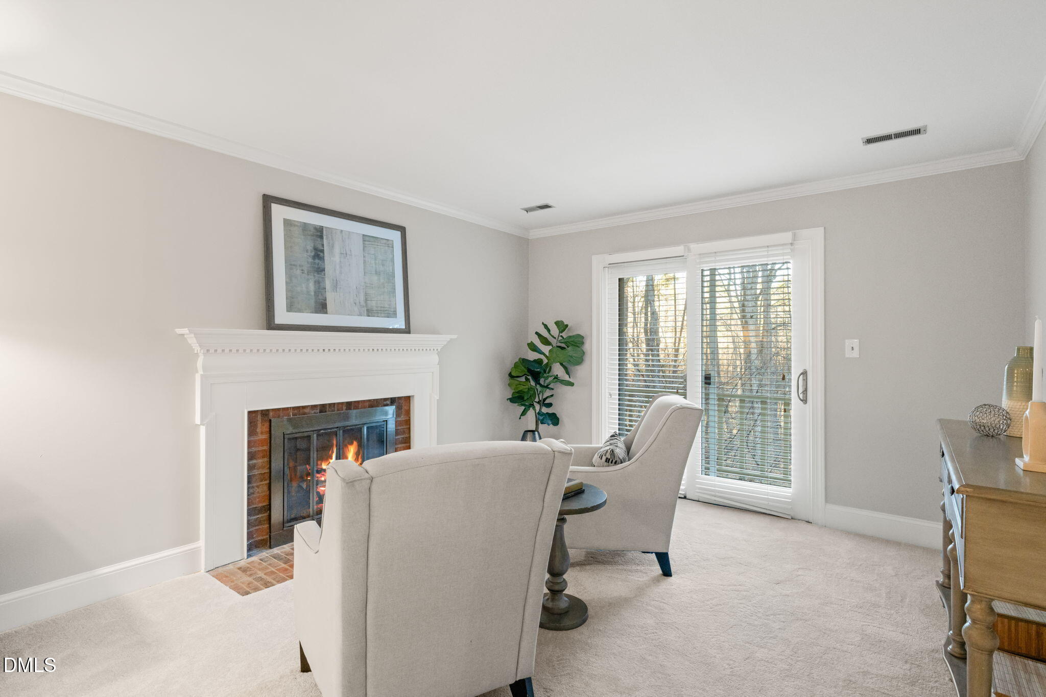 2300 Vly Frg Road Raleigh, NC 27615 - Photo 28 of 62 a living room with furniture and a fireplace