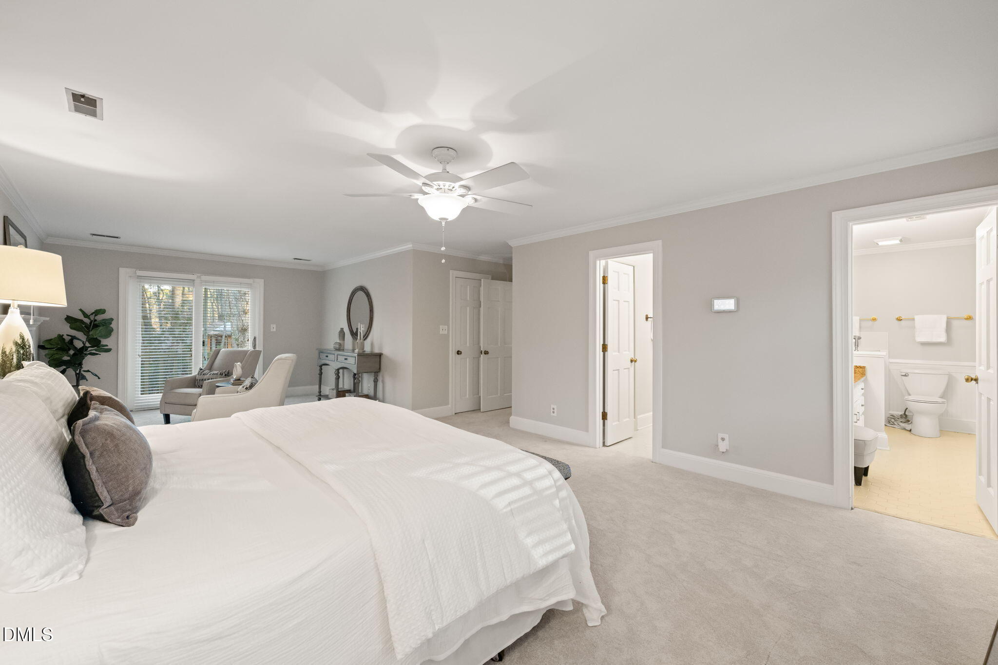 2300 Vly Frg Road Raleigh, NC 27615 - Photo 33 of 62 a spacious bedroom with a bed a chandelier and large window