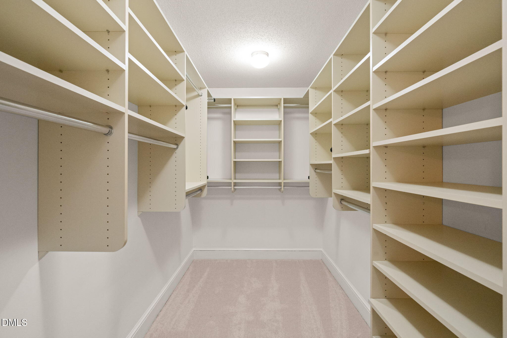 2300 Vly Frg Road Raleigh, NC 27615 - Photo 36 of 62 a view of walk in closet with empty racks