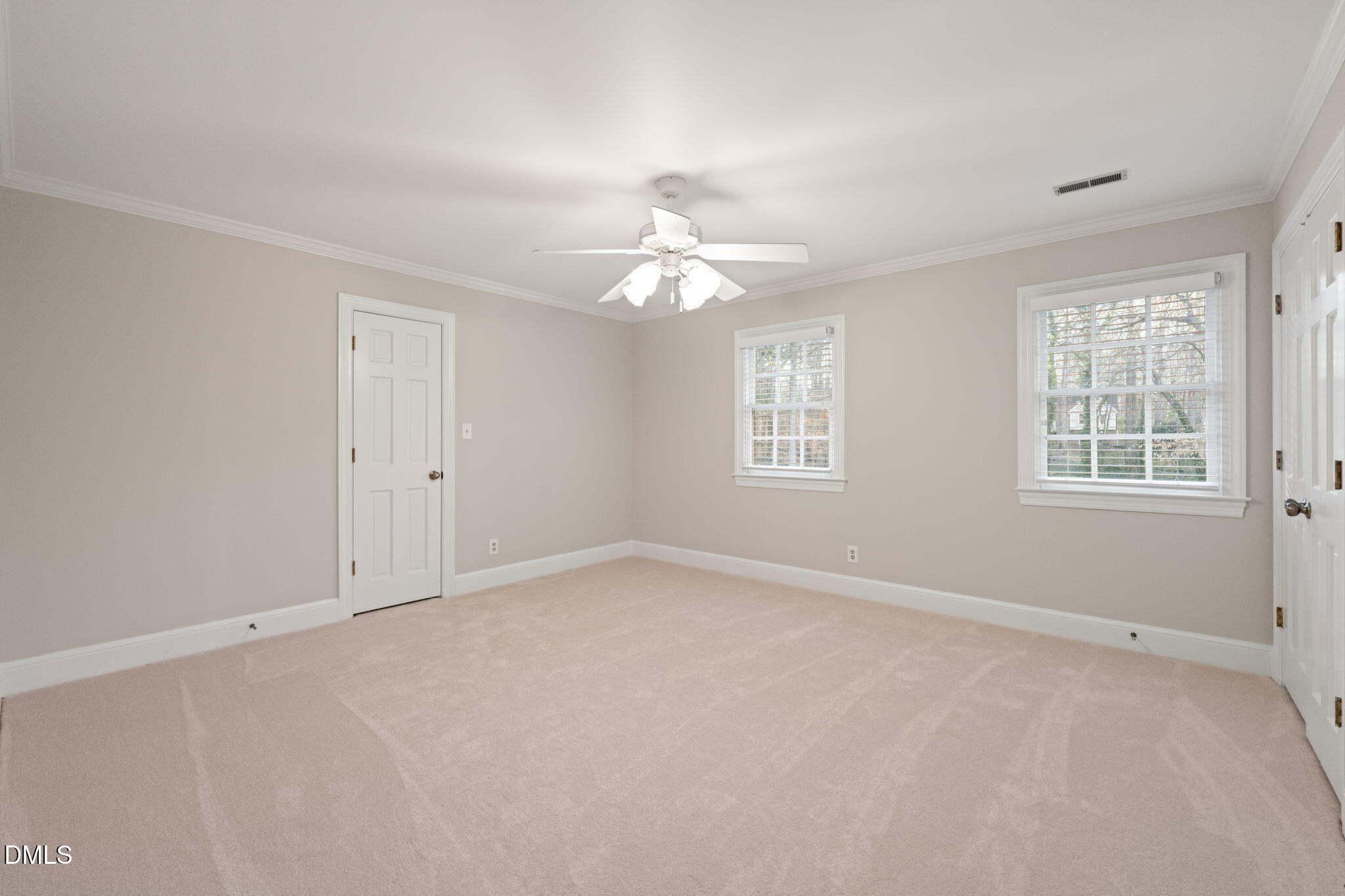 2300 Vly Frg Road Raleigh, NC 27615 - Photo 40 of 62 an empty room with windows and chandelier fan