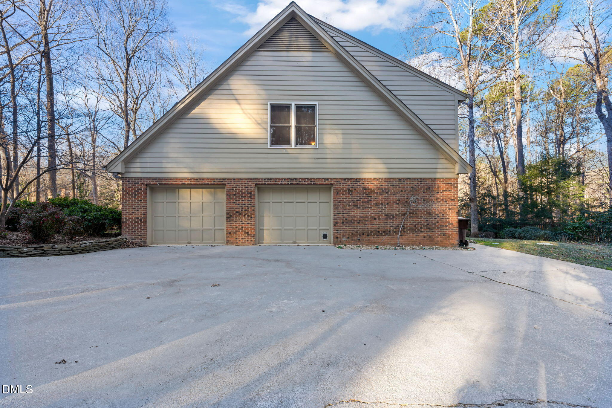2300 Vly Frg Road Raleigh, NC 27615 - Photo 52 of 62 a front view of a house with a yard and garage