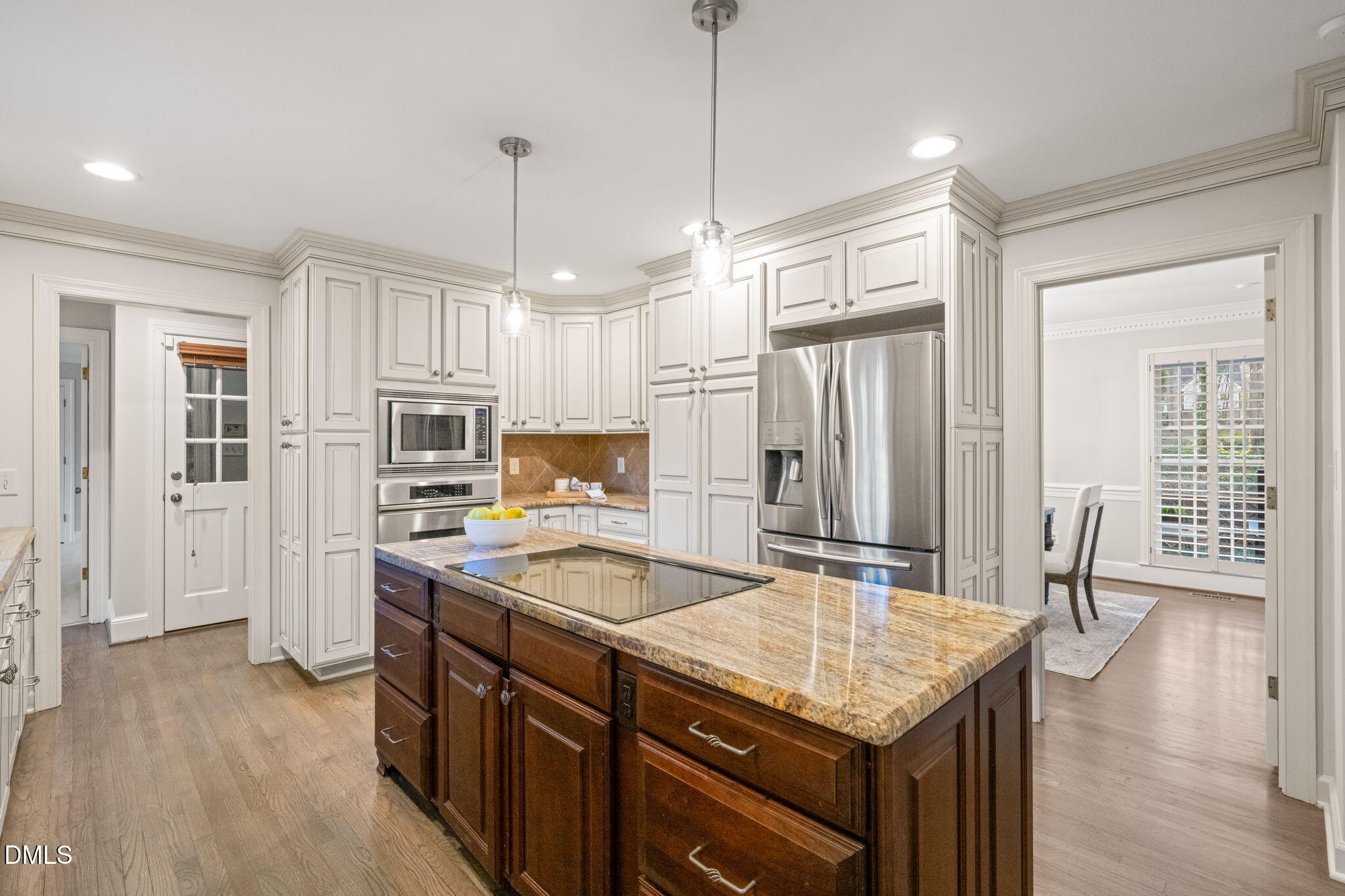 2300 Vly Frg Road Raleigh, NC 27615 - Photo 8 of 62 a kitchen with granite countertop a sink stove and refrigerator