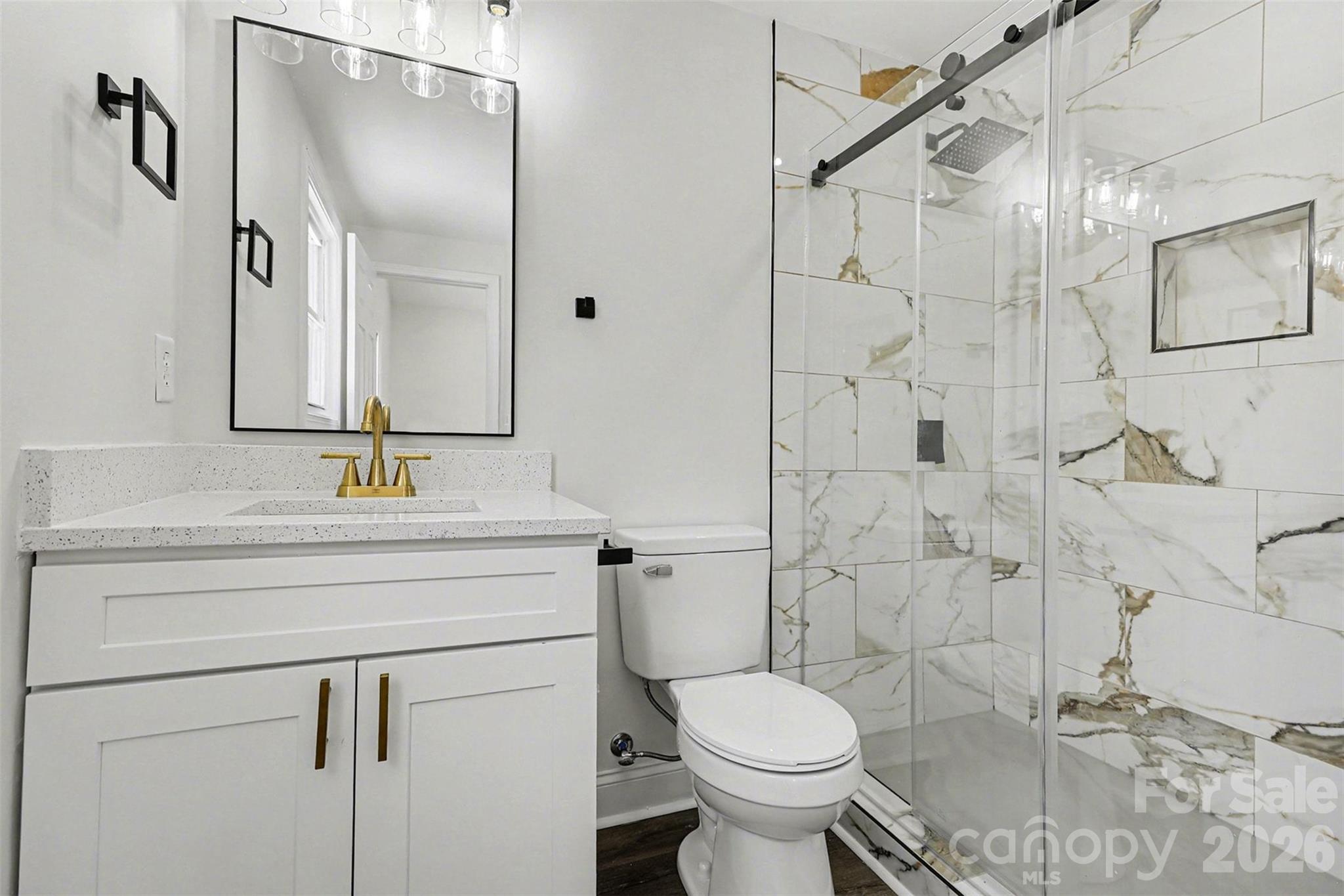 1013 Ridge Avenue Gastonia, NC 28052 - Photo 17 of 33 a bathroom with a sink toilet and shower