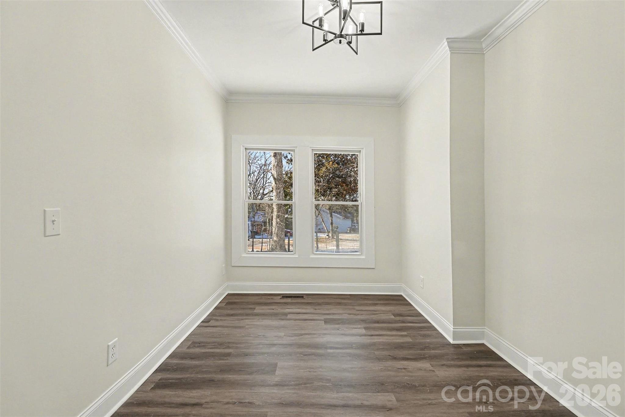 1013 Ridge Avenue Gastonia, NC 28052 - Photo 18 of 33 a view of an empty room with wooden floor and a window