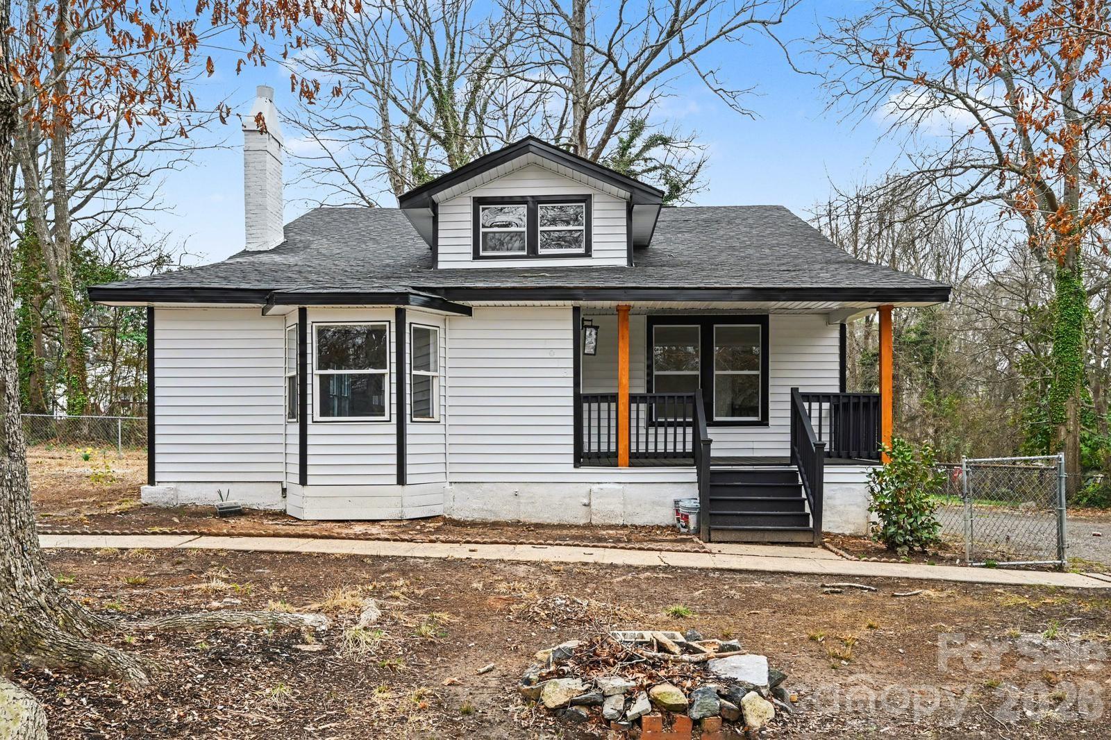 1013 Ridge Avenue Gastonia, NC 28052 - Photo 2 of 33 a front view of a house with a yard and garage