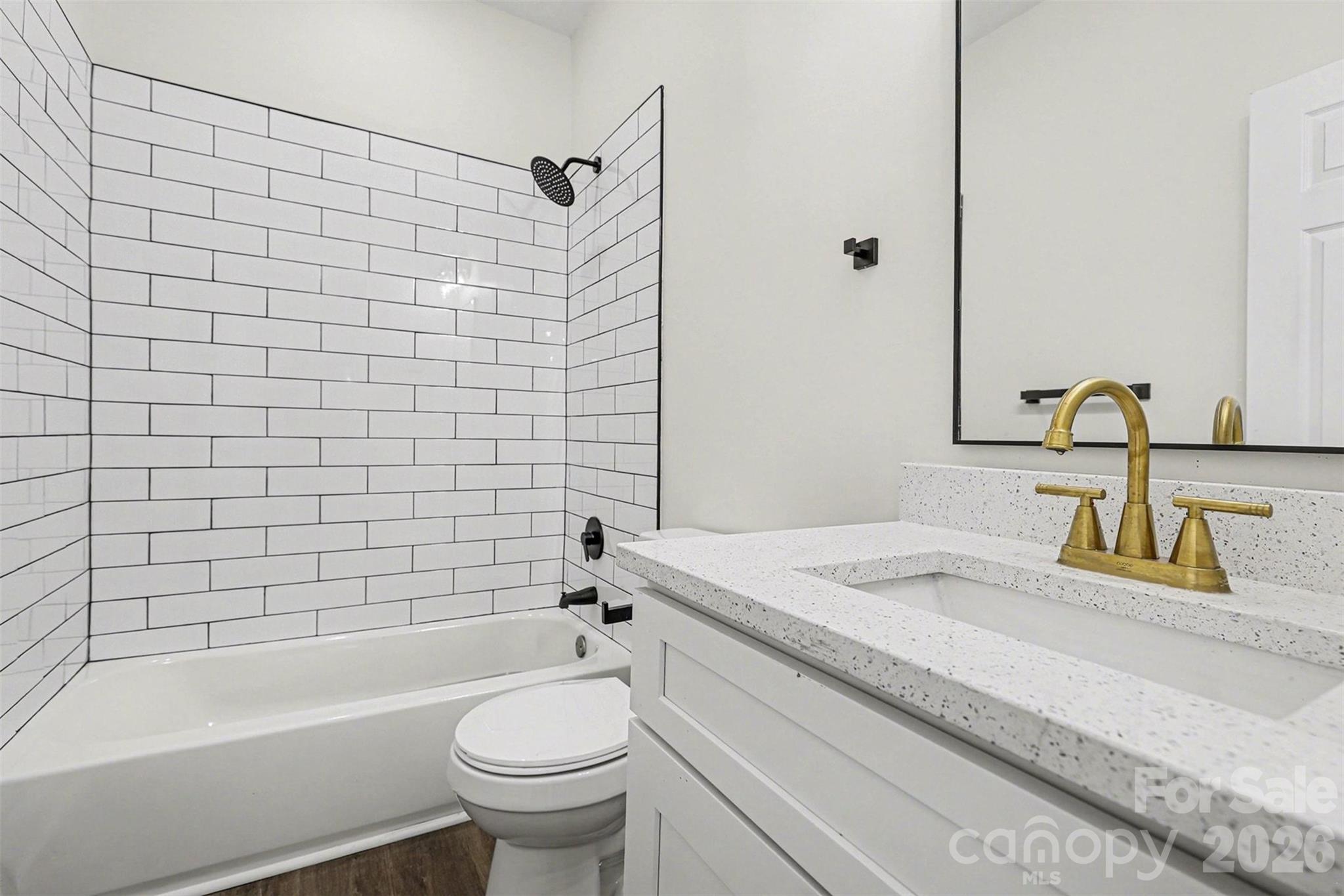 1013 Ridge Avenue Gastonia, NC 28052 - Photo 22 of 33 a bathroom with a sink a toilet and shower