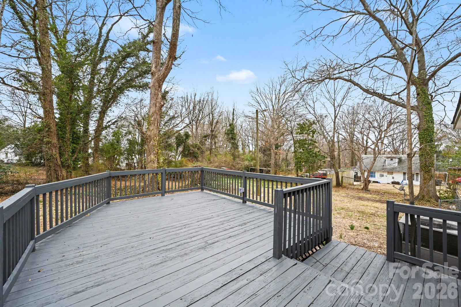 1013 Ridge Avenue Gastonia, NC 28052 - Photo 30 of 33 a view of balcony with wooden floor and outdoor seating