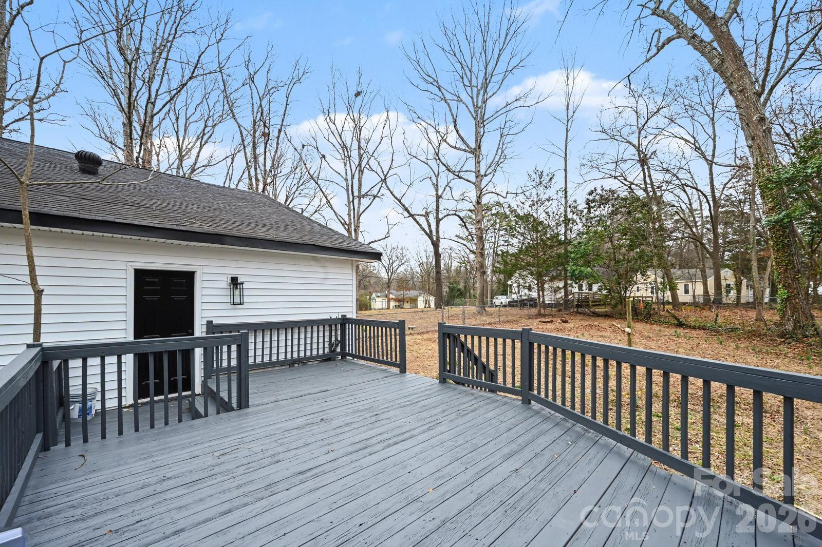 1013 Ridge Avenue Gastonia, NC 28052 - Photo 31 of 33 a view of a wooden deck and a backyard