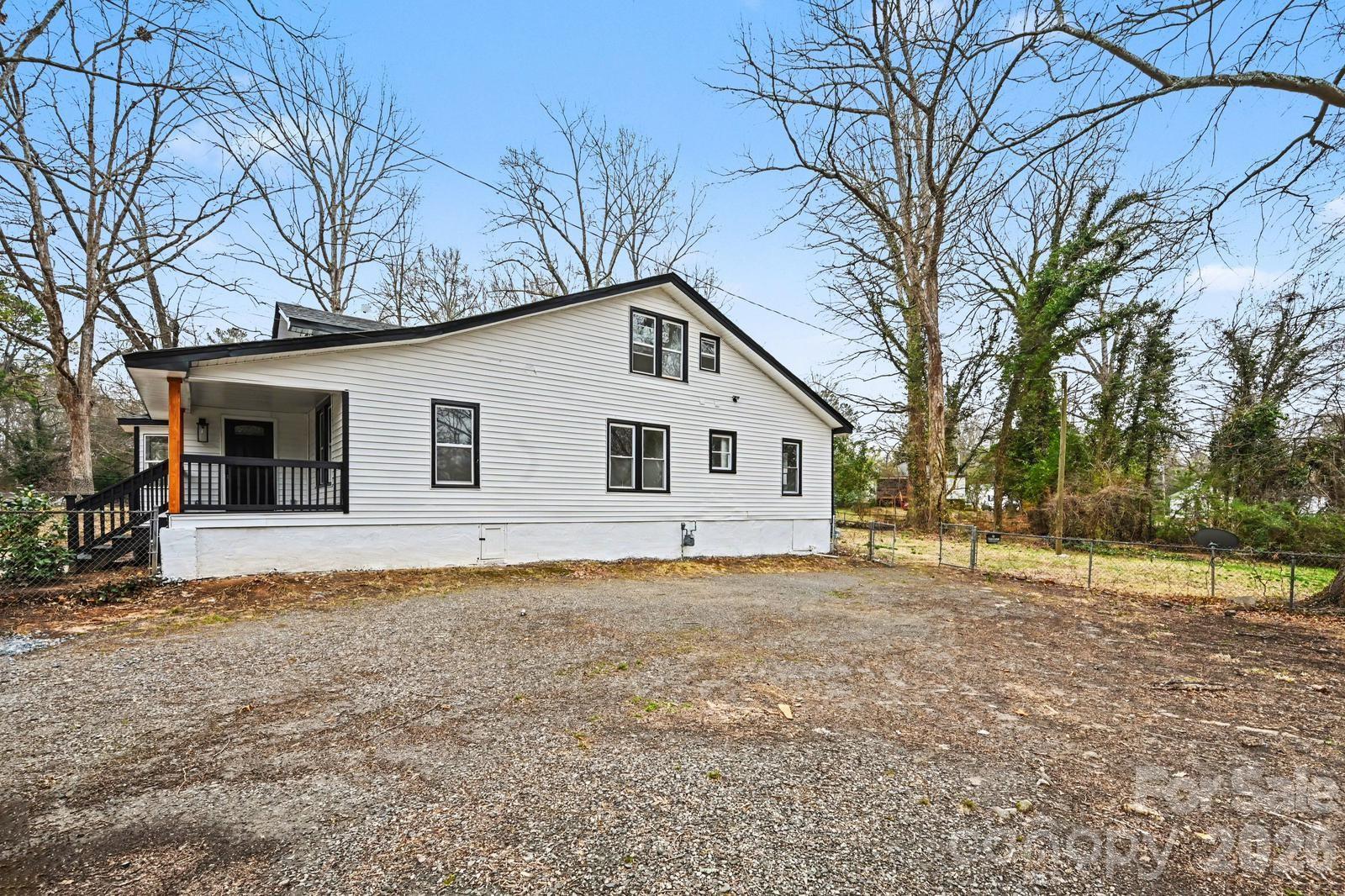1013 Ridge Avenue Gastonia, NC 28052 - Photo 32 of 33 a front view of a house with a yard