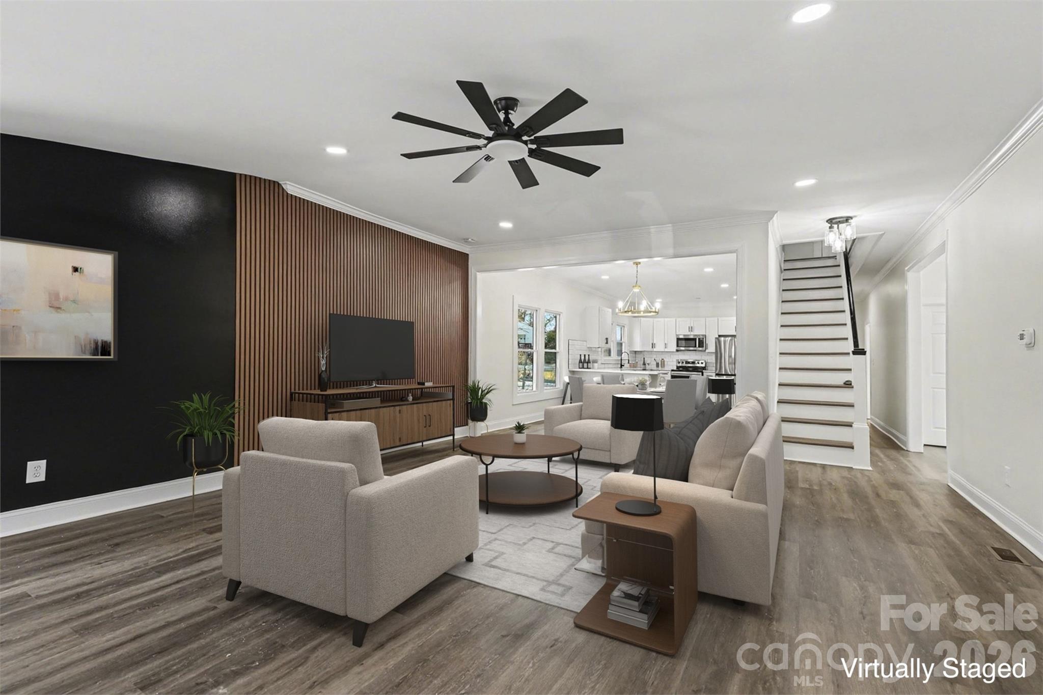 1013 Ridge Avenue Gastonia, NC 28052 - Photo 7 of 33 a living room with furniture kitchen view and a wooden floor