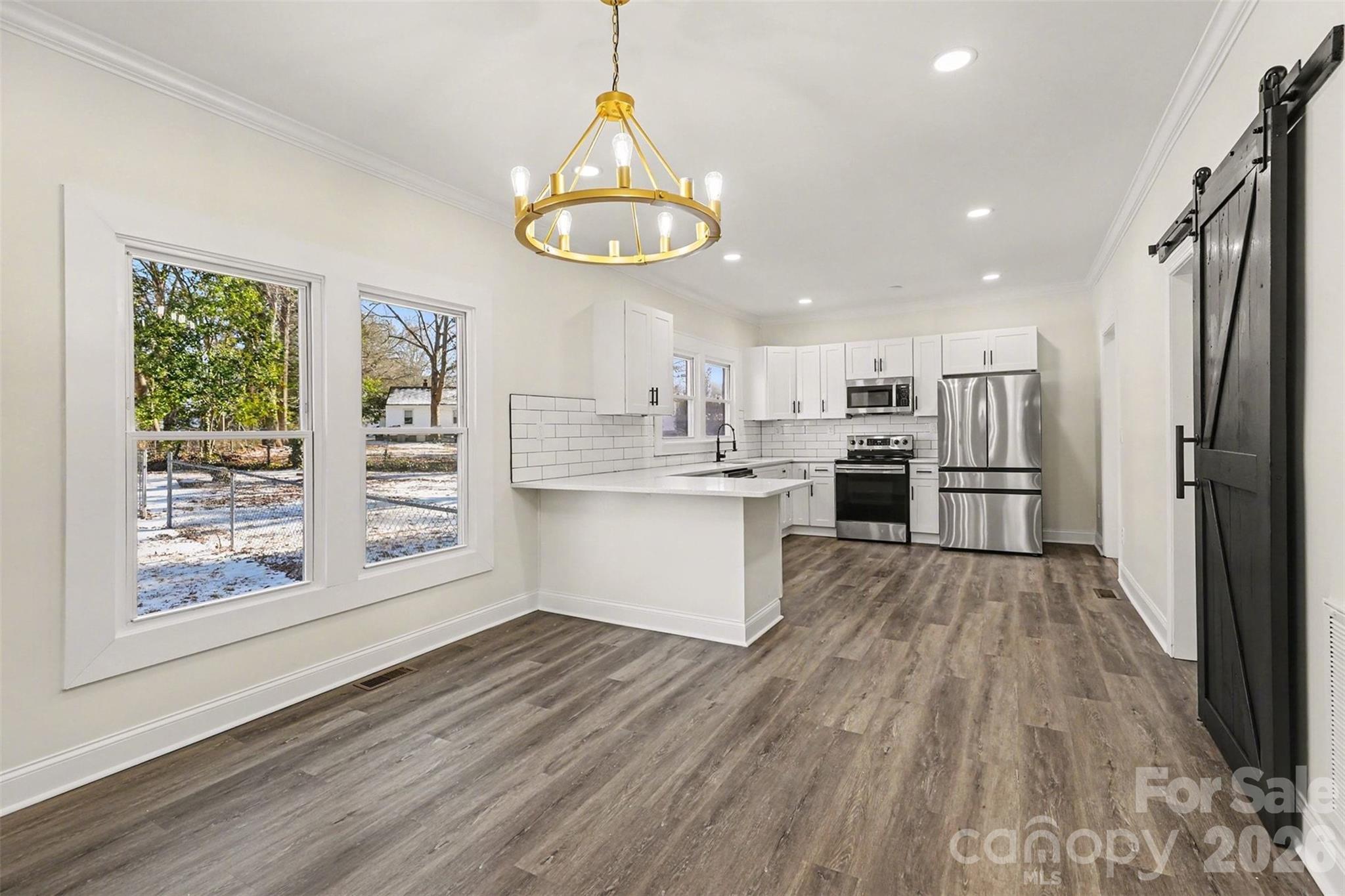 1013 Ridge Avenue Gastonia, NC 28052 - Photo 9 of 33 a kitchen with stainless steel appliances a refrigerator and a stove top oven