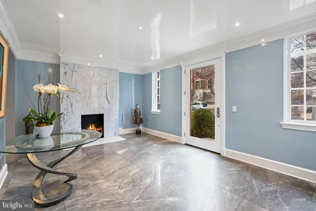 a view of a livingroom with furniture and a fireplace