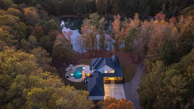 a aerial view of a house with swimming pool and sitting area