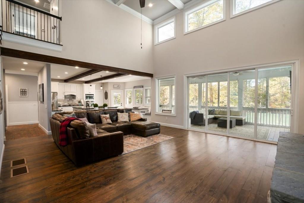 3055 Spring Hill Drive Monroe, GA 30656 - Photo 12 of 64 a living room with furniture wooden floor and large windows