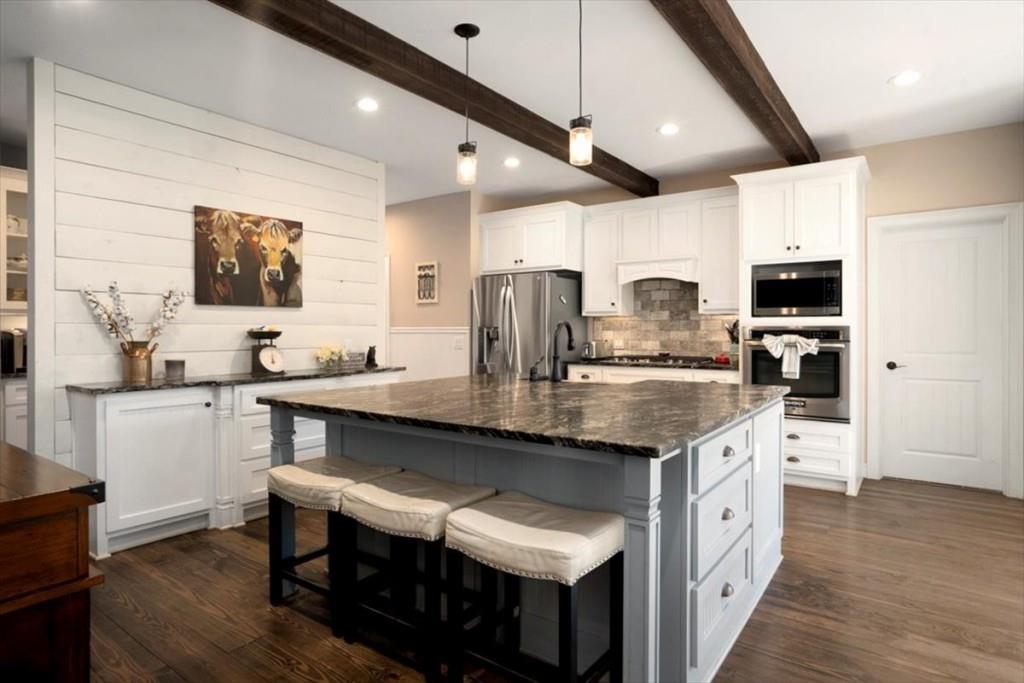 3055 Spring Hill Drive Monroe, GA 30656 - Photo 16 of 64 a kitchen with stainless steel appliances granite countertop a sink a stove and a refrigerator