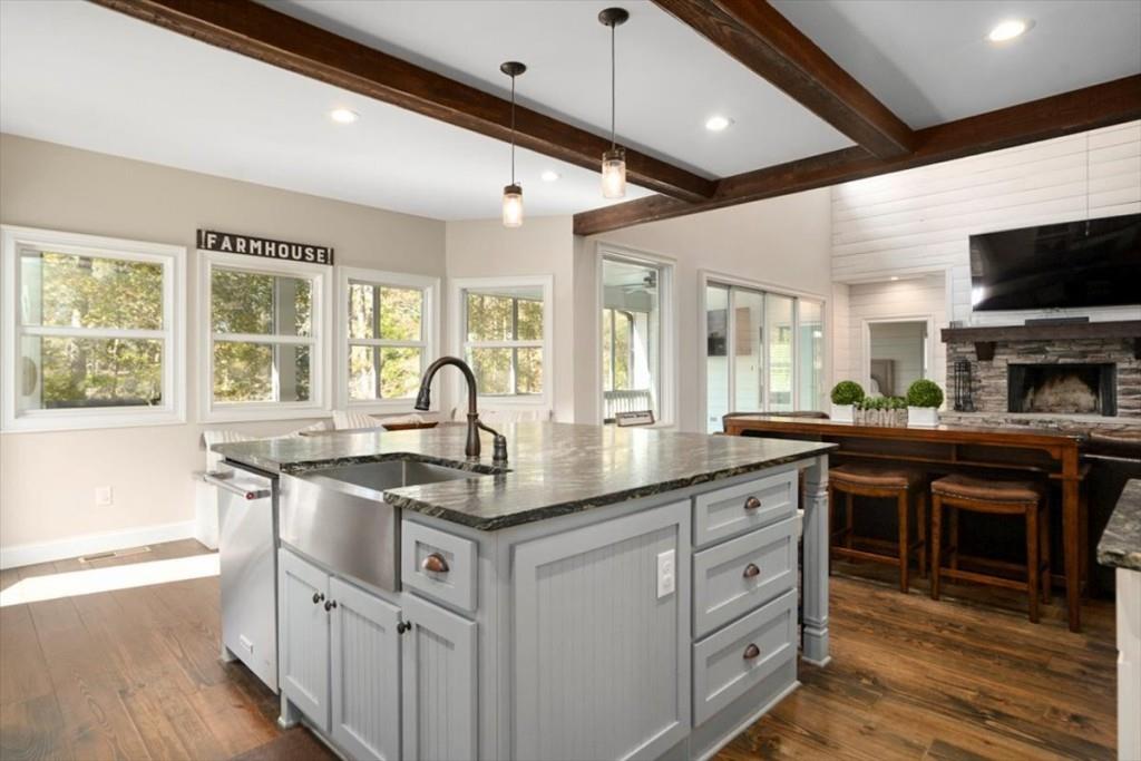 3055 Spring Hill Drive Monroe, GA 30656 - Photo 18 of 64 a kitchen with stainless steel appliances granite countertop a stove and a sink