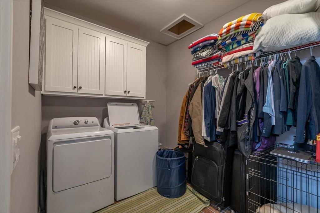 3055 Spring Hill Drive Monroe, GA 30656 - Photo 26 of 64 a view of walk in closet with clothes and shoes