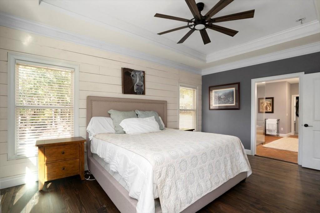 3055 Spring Hill Drive Monroe, GA 30656 - Photo 28 of 64 a bedroom with a bed and a chandelier