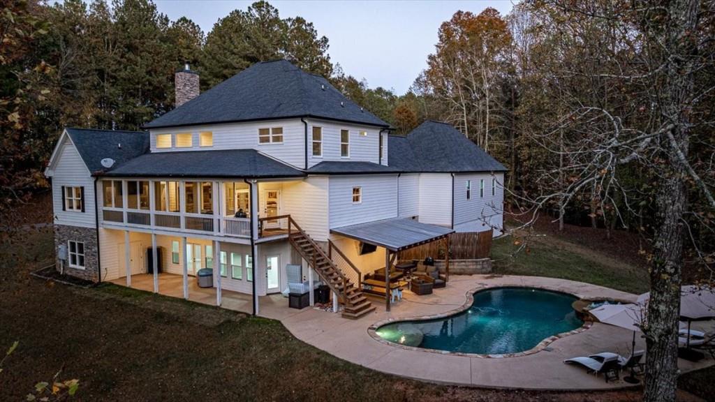 3055 Spring Hill Drive Monroe, GA 30656 - Photo 3 of 64 a aerial view of a house with swimming pool and sitting area