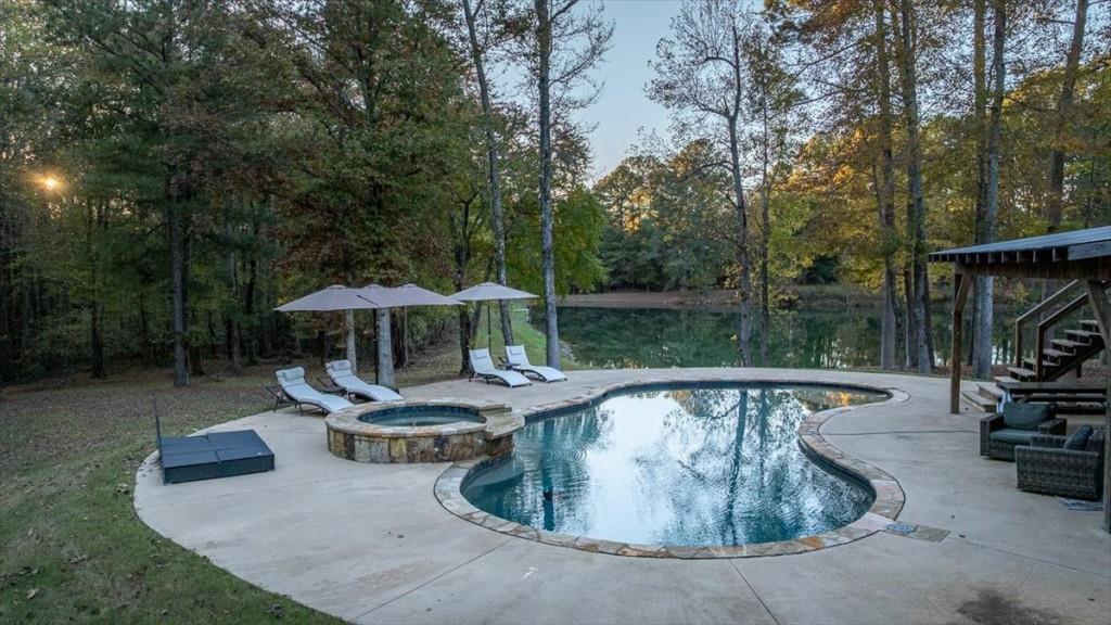3055 Spring Hill Drive Monroe, GA 30656 - Photo 45 of 64 a view of a swimming pool with a patio