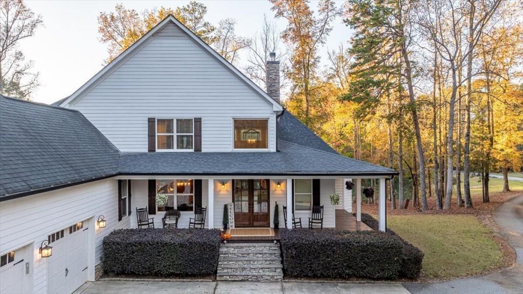 3055 Spring Hill Drive Monroe, GA 30656 - Photo 6 of 64 a front view of a house with a yard