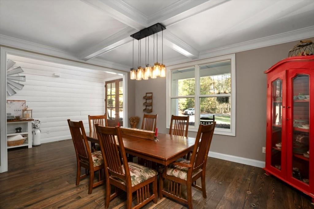 3055 Spring Hill Drive Monroe, GA 30656 - Photo 8 of 64 a dining room with furniture a chandelier and wooden floor