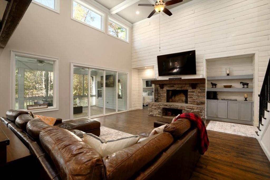 3055 Spring Hill Drive Monroe, GA 30656 - Photo 10 of 64 a living room with furniture a flat screen tv and a fireplace