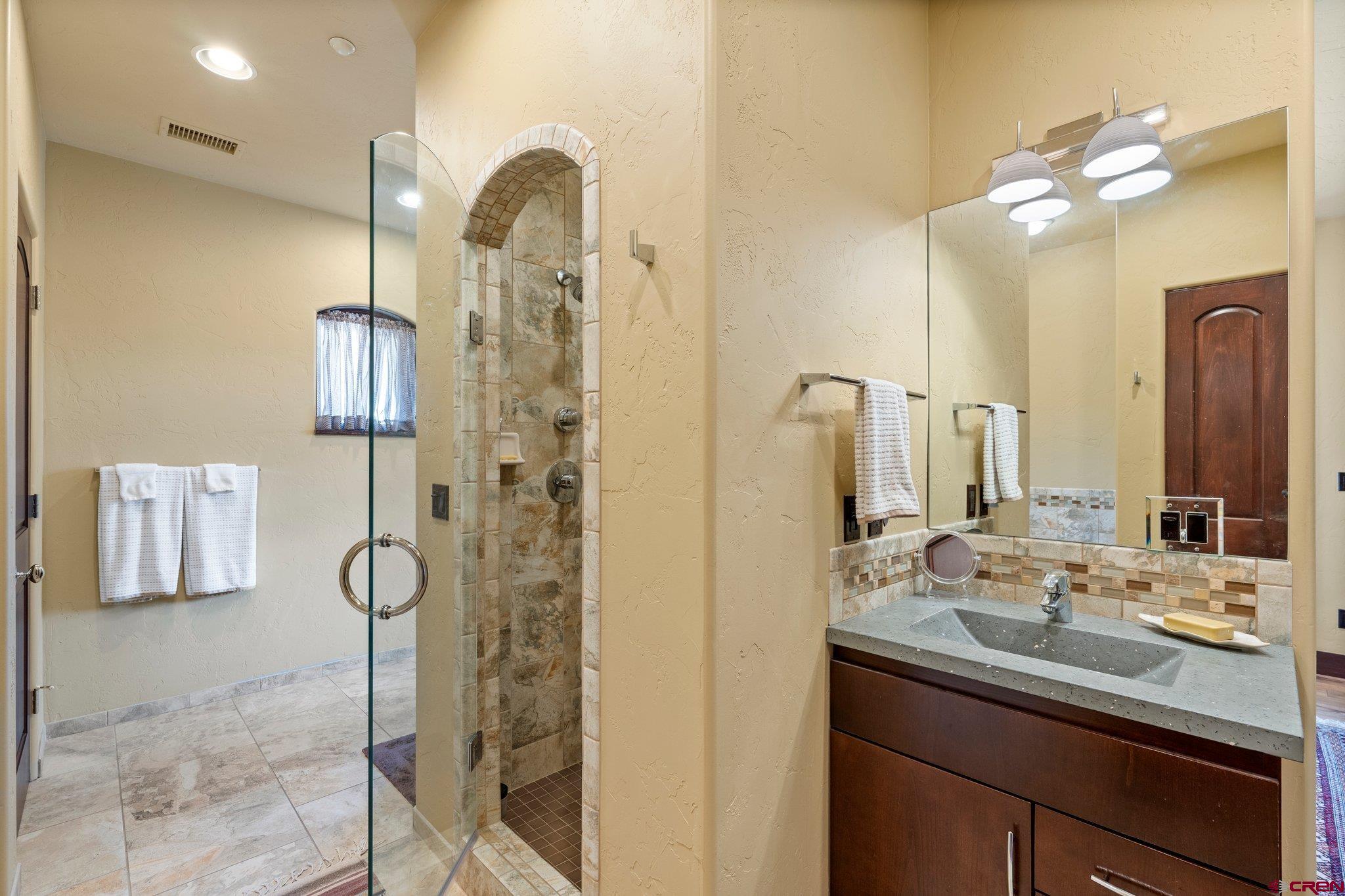 3416 Main Avenue, Unit 203 Durango, CO 81301 - Photo 18 of 34 a bathroom with a sink vanity and a mirror