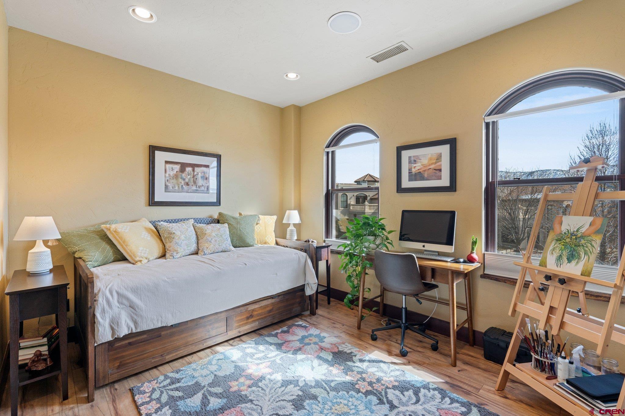 3416 Main Avenue, Unit 203 Durango, CO 81301 - Photo 22 of 34 a living room with a couch and a flat screen tv