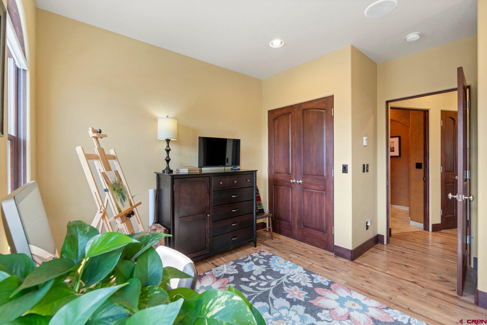 3416 Main Avenue, Unit 203 Durango, CO 81301 - Photo 24 of 34 a room with furniture a flat screen tv and a potted plant