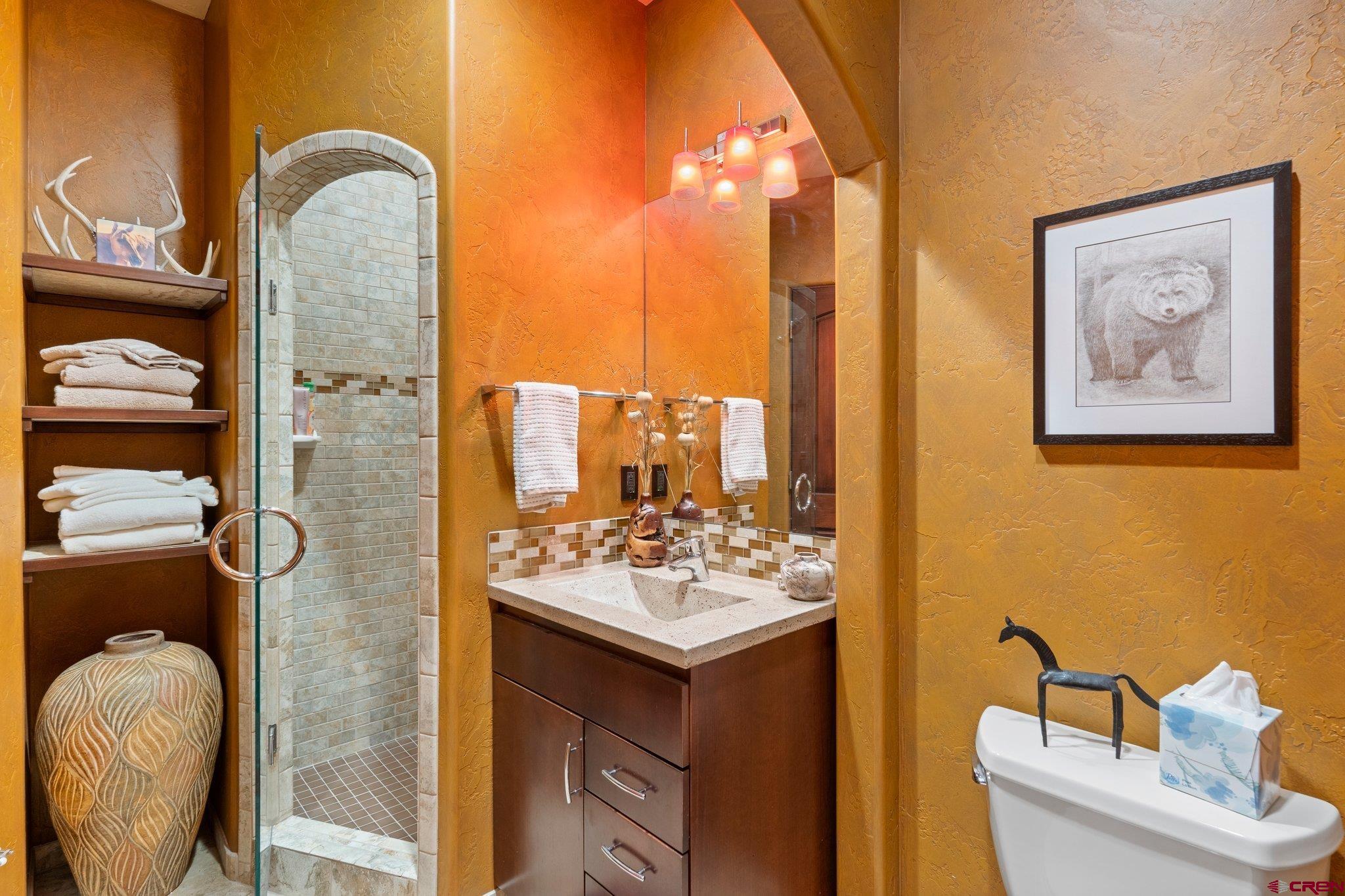 3416 Main Avenue, Unit 203 Durango, CO 81301 - Photo 25 of 34 a bathroom with a sink mirror and toilet