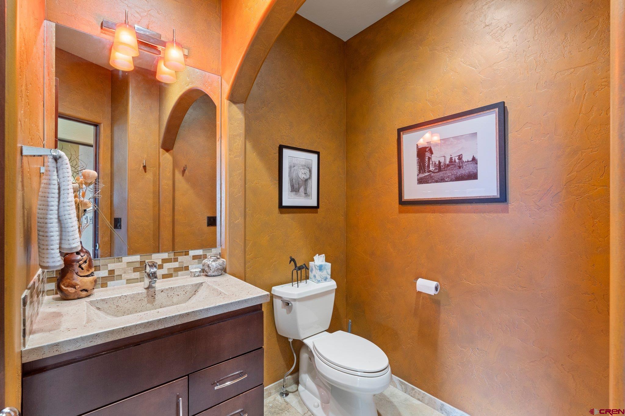 3416 Main Avenue, Unit 203 Durango, CO 81301 - Photo 26 of 34 a bathroom with a granite countertop sink mirror vanity and toilet